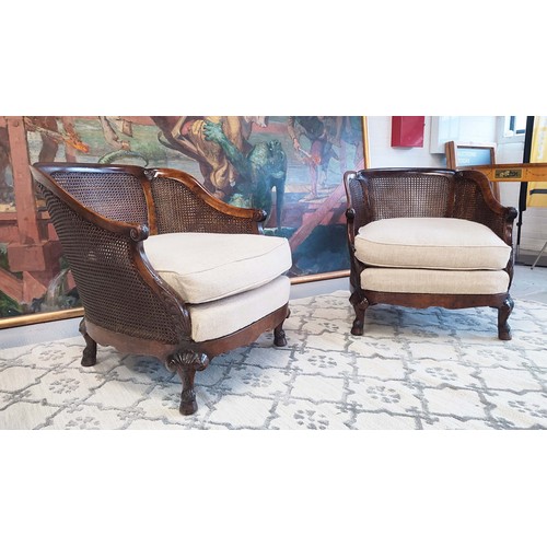 283 - BERGERES, a pair, Georgian revival burr walnut and double caned with taupe fabric seat cushions, 82c... 