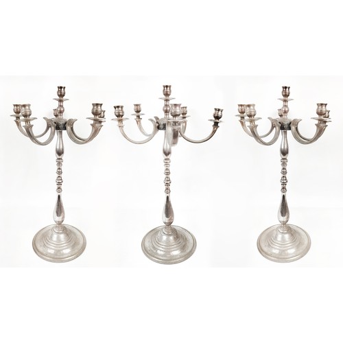 25 - A SET OF THREE SILVER PLATED FIVE BRANCH CANDELABRA, plus a further four branch candelabra, 69cm H. ... 