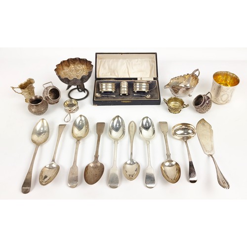 24 - A COLLECTION OF EIGHT GEORGE III AND LATER SILVER TABLE SPOONS, a label and a cake slice, various as... 