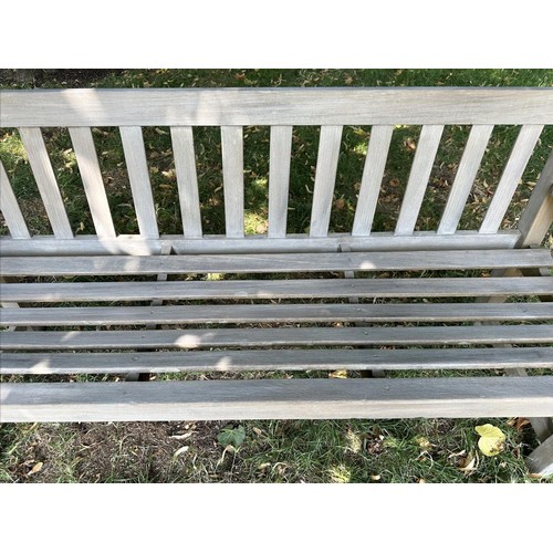 425 - GARDEN BENCH, well weathered teak, slatted and dowelled construction, 121cm W.