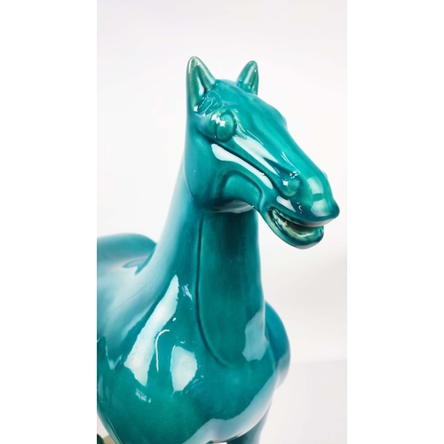 1 - TANG STYLE POTTERY HORSES, a pair, with a turquoise glaze, 50cm L x 51cm H. (2)