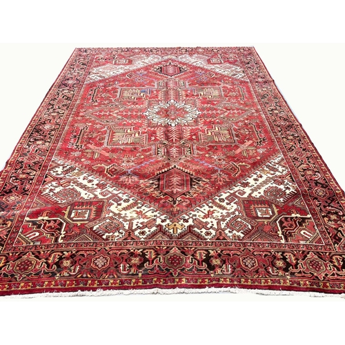 106 - MID 20TH CENTURY PERSIAN HERIZ CARPET, 387cm x 297cm.