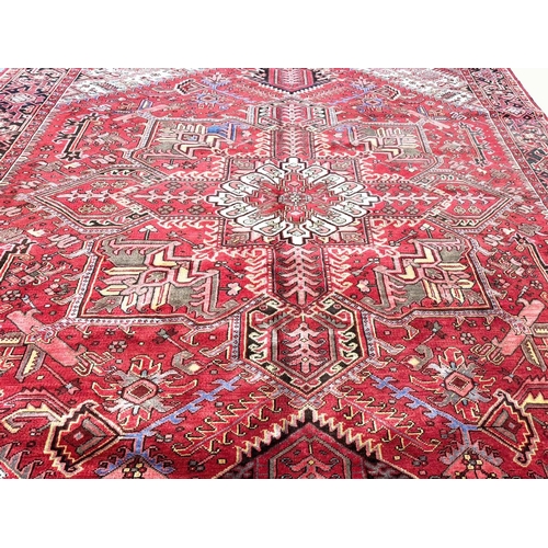 106 - MID 20TH CENTURY PERSIAN HERIZ CARPET, 387cm x 297cm.