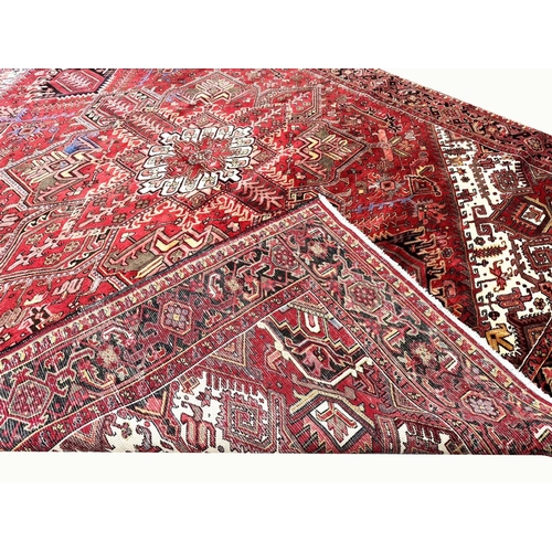 106 - MID 20TH CENTURY PERSIAN HERIZ CARPET, 387cm x 297cm.