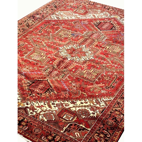 106 - MID 20TH CENTURY PERSIAN HERIZ CARPET, 387cm x 297cm.