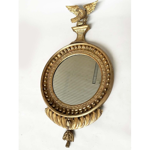 131 - WALL MIRROR, George IV carved giltwood, the circular ball-encrusted framed plate, with eagle surmoun... 