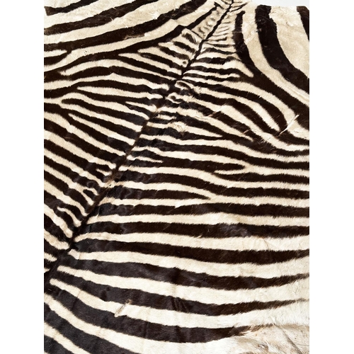 134 - ZEBRA SKIN RUG, early 20th century, 300cm x 160cm.