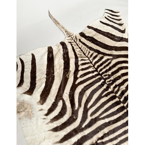 134 - ZEBRA SKIN RUG, early 20th century, 300cm x 160cm.