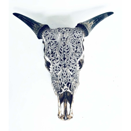 135 - SPANISH BULLS SKULL, with carved and pierced scroll work detail, 46cm W x 49cm H.