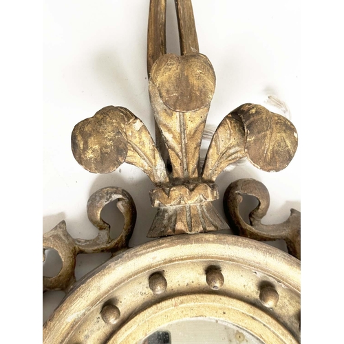 140 - GIRANDOLE, late 19th century Regency style carved giltwood with convex 'ball' mirror, fleur-de-lis, ... 