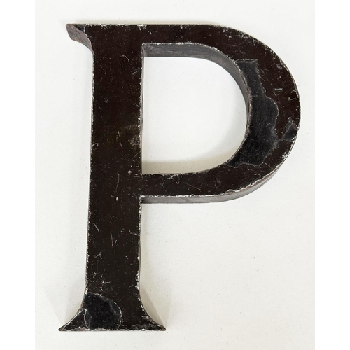 152 - LETTERS, twenty one early 20th century metal sign letters, 23cm H. (21)