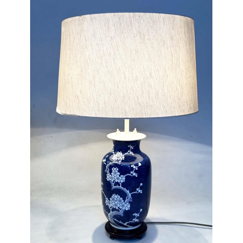 154 - TABLE LAMPS, two, comprising a Chinese blue and white ceramic vase form with striped shade and a vas... 