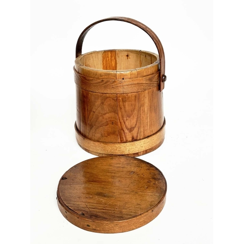 155 - RICE BUCKETS, two antique earthen varnished fir, tapering with handles, one lidded, 26cm W. (2)