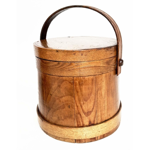 155 - RICE BUCKETS, two antique earthen varnished fir, tapering with handles, one lidded, 26cm W. (2)