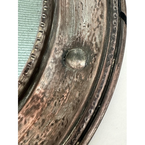 161 - COPPER WALL MIRROR, early 20th century hand beaten Newlyn style copper, circular together with an oc... 