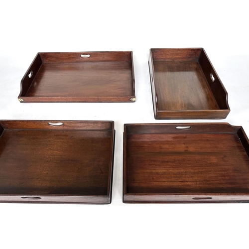 162 - GEORGIAN BUTLER TRAYS, four Georgian mahogany, each galleried with pierced handles, largest 67cm x 4... 