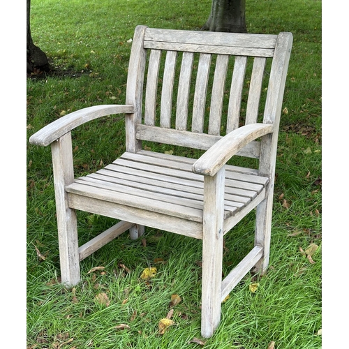 164 - GARDEN ARMCHAIRS, a pair, well weathered teak of slatted construction with curved arms, 68cm W. (2)