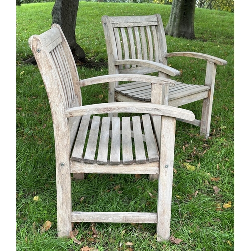 164 - GARDEN ARMCHAIRS, a pair, well weathered teak of slatted construction with curved arms, 68cm W. (2)