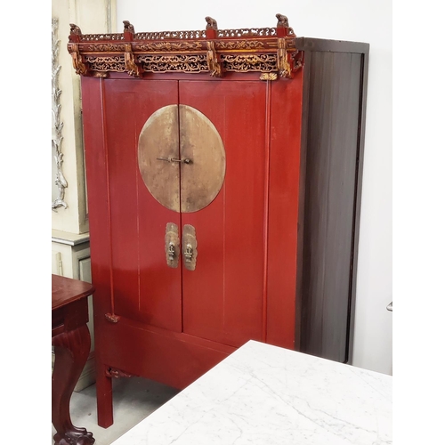 167 - CHINESE MARRIAGE CABINET, 101cm x 70cm D x 180cm H, red lacquer with carved and gilded fretwork deta... 