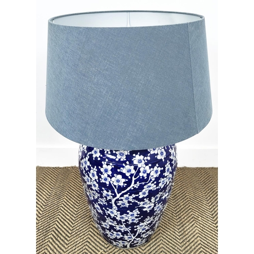 214 - TABLE LAMP, of substantial proportions barrel form with blue and white floral decoration.