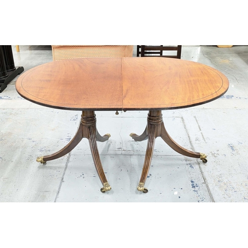 246 - TWIN PEDESTAL DINING TABLE, early 20th century Georgian style mahogany with elliptical ends and two ... 