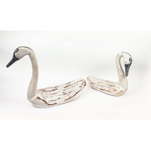 3 - SWANS, two, hand carved wood in a distressed finish, largest 85cm L x 45cm H. (2)