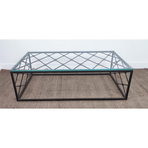 349 - COFFEE TABLE, with a glass top on a metal lattice frame, 76cm D x 140cm L x 47cm H.