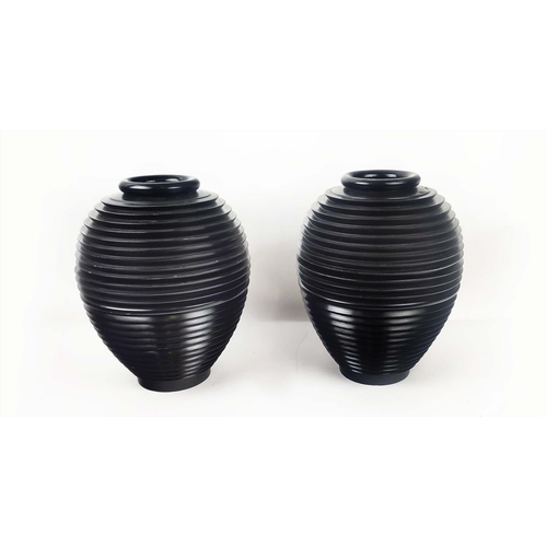 4 - VASES, a pair, black ridged wood, each separating at the centre. (2)