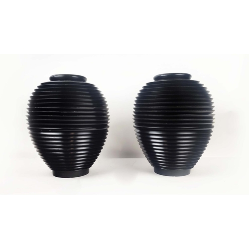 4 - VASES, a pair, black ridged wood, each separating at the centre. (2)