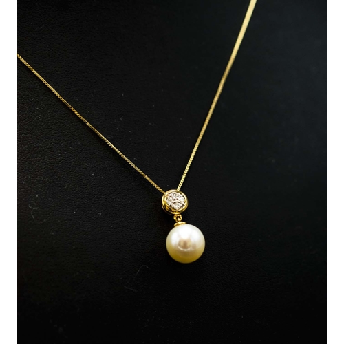 42 - 9CT YELLOW GOLD CULTURED PEARL AND DIAMOND BALE PENDANT, with 9ct yellow gold box link chain, boxed.... 