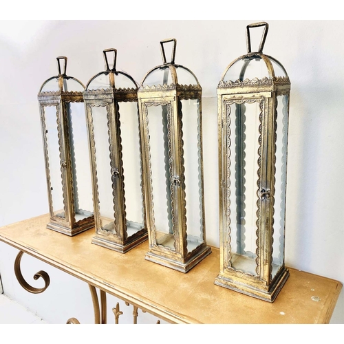 430 - LANTERNS, a set of four, Regency style gilt metal and glass, 62cm H x 15cm W x 15cm D. (4)