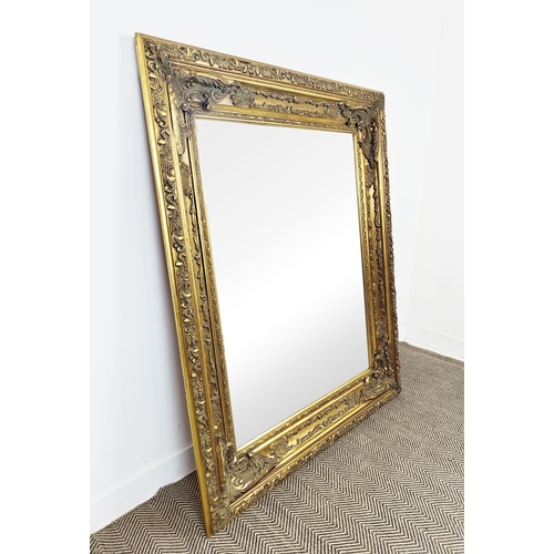 437 - WALL MIRROR, bevelled plate within on ornate gilt frame, 159cm H x 128cm.