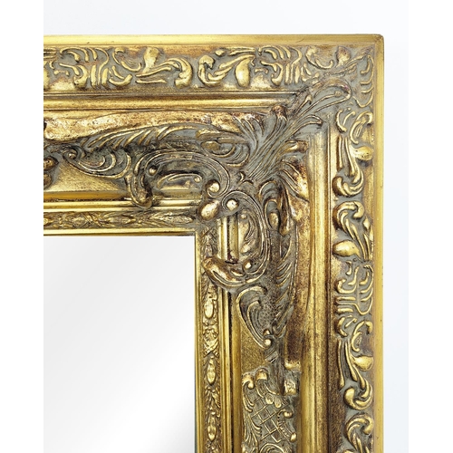 437 - WALL MIRROR, bevelled plate within on ornate gilt frame, 159cm H x 128cm.