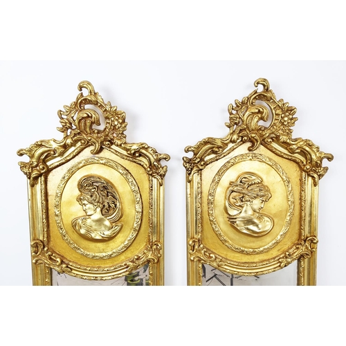 459 - TRUMEAU PIER MIRRORS, a pair, bevelled plates within ornate gilt frames, 177cm H x 50cm. (2)