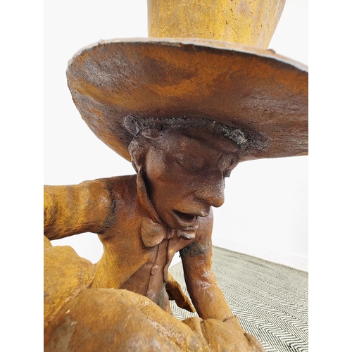 484 - MAD HATTER GARDEN SCULPTURE, cast iron with an oxidised finish, 108cm H x 45cm x 60cm.