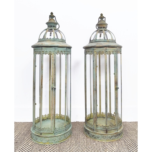 491 - LANTERNS, a pair, Regency style verdigris finish metal and glass, 83cm H x 27cm. (2)