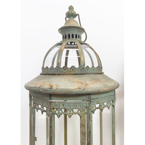 491 - LANTERNS, a pair, Regency style verdigris finish metal and glass, 83cm H x 27cm. (2)