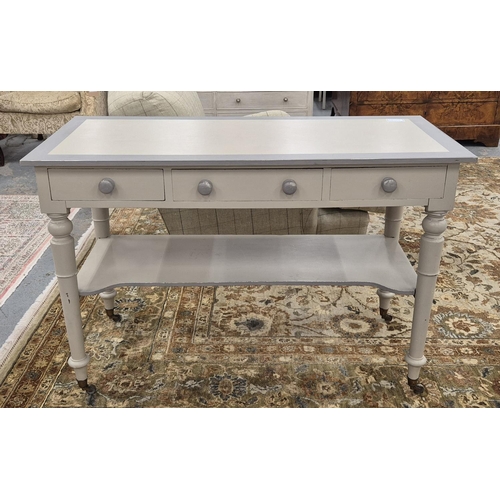 505 - PAINTED WASHSTAND/SIDE TABLE, with three frieze drawers and turned supports, 118cm x 54cm x 79cm.