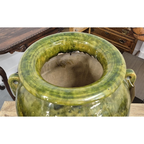 508 - URN, green glazed of large proportions, 72cm H x 43cm.