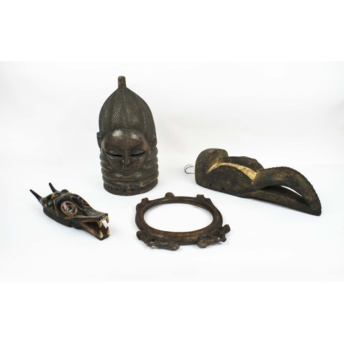 7 - MENDE HELMET MASK, a bird beak mask, a carved neck ring with monkey decoration and a guro mask. (4)