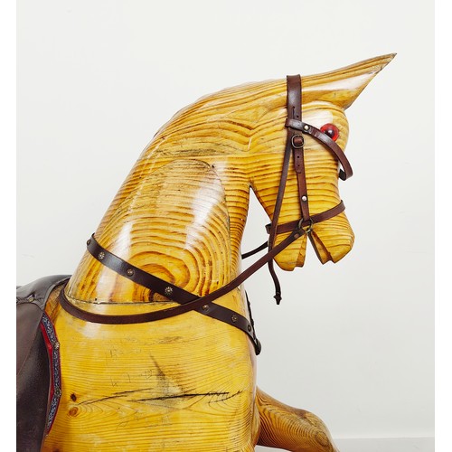 253 - ROCKING HORSE, vintage pine and leather on painted base, 126cm H x 183cm L x 56cm W.