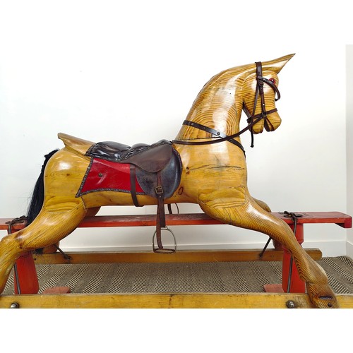 253 - ROCKING HORSE, vintage pine and leather on painted base, 126cm H x 183cm L x 56cm W.