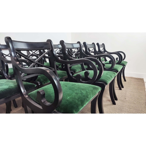 167 - DINING CHAIRS, a set of fourteen Regency style, ebonised with scroll arms and green velvet drop in s... 