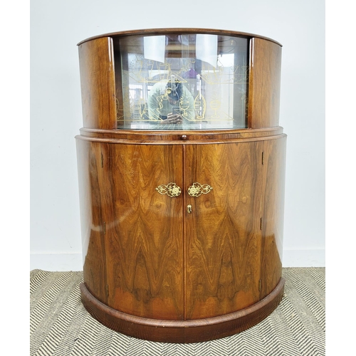 146 - DEMI LUNE ART DECO COCKTAIL CABINET, walnut with sliding glass doors, decorative mirrored back over ... 