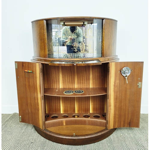 146 - DEMI LUNE ART DECO COCKTAIL CABINET, walnut with sliding glass doors, decorative mirrored back over ... 