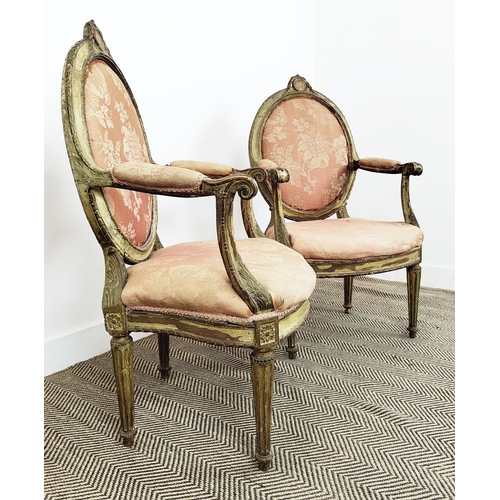 172 - OPEN ARMCHAIRS, a pair, 18th century Italian painted and giltwood with oval padded backs, 104cm H x ... 