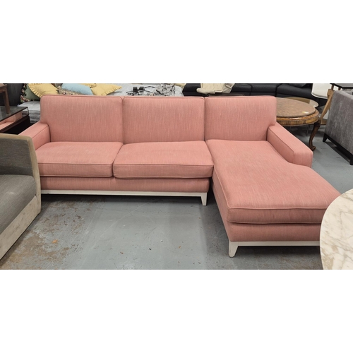 425 - CORNER SOFA, white painted supports, pink fabric upholstered.