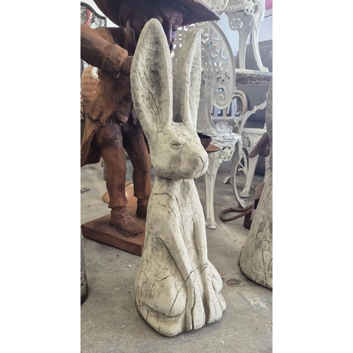 448 - SCULPTURAL HARES, a pair, composite stone, 68cm H approx.