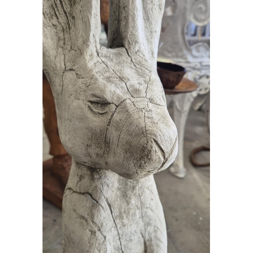 448 - SCULPTURAL HARES, a pair, composite stone, 68cm H approx.