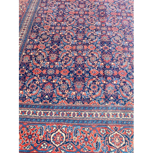 86 - ANTIQUE TABRIZ HERATI DESIGN CARPET, 335cm x 240cm.